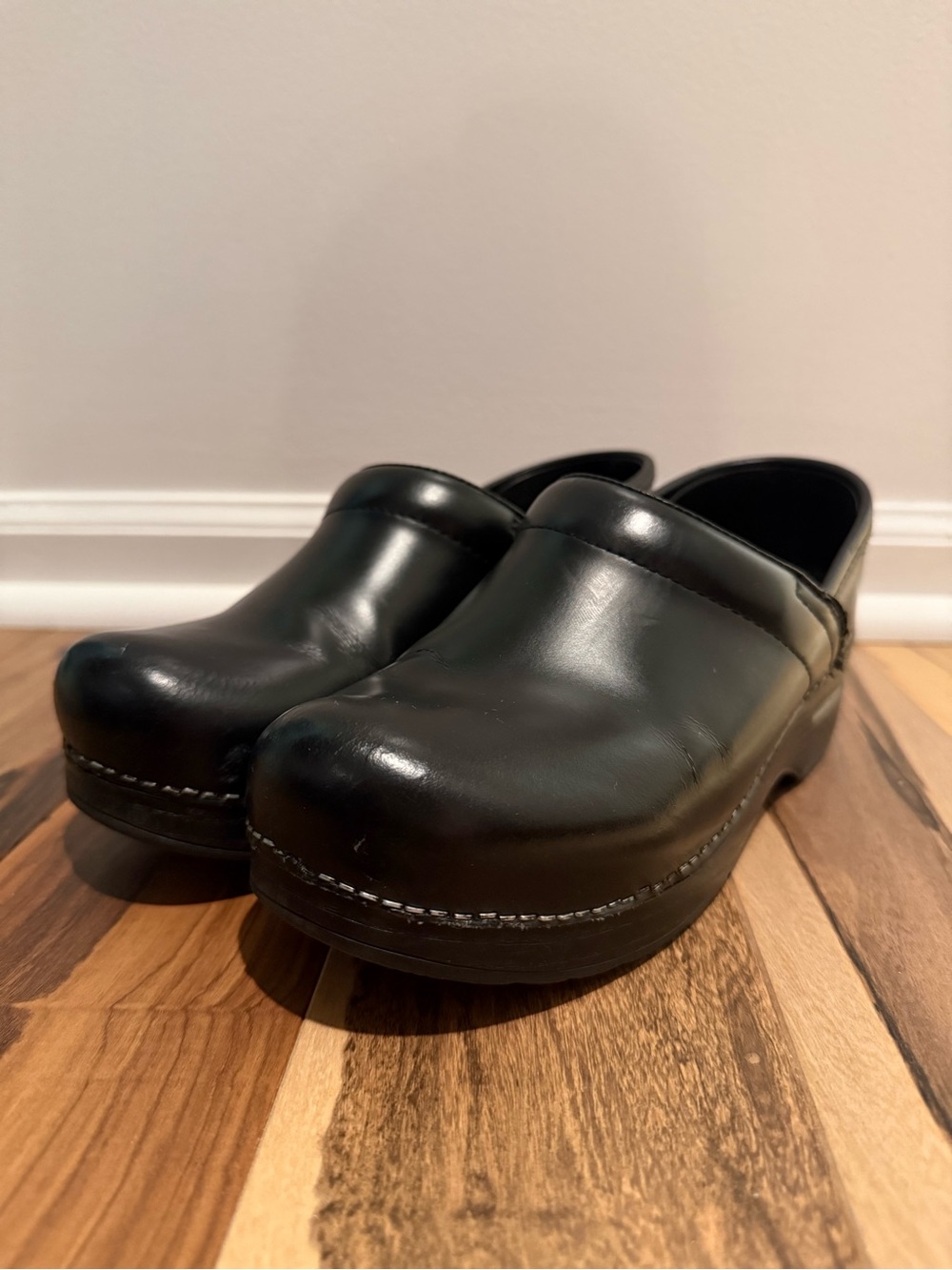 Dansko women’s Black Leather Slip-On Clogs